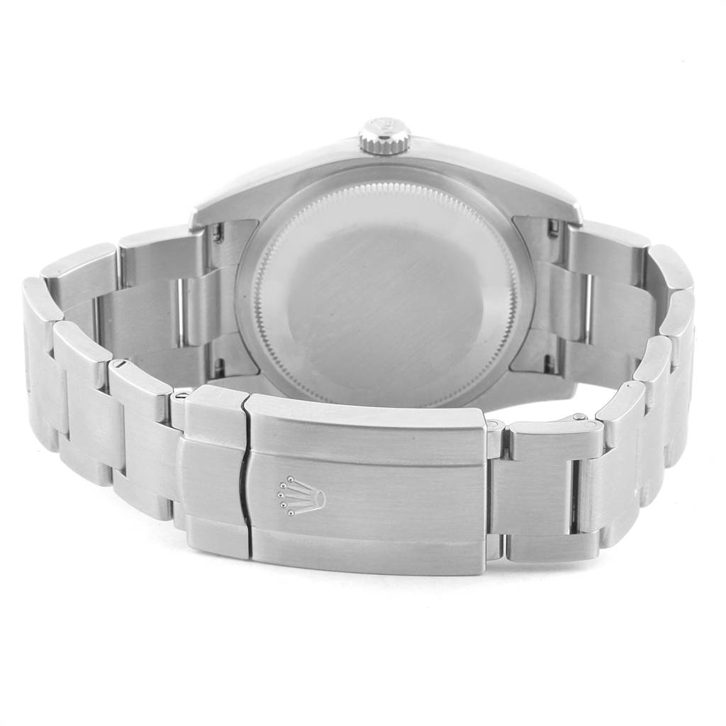 The image shows the rear view of a Rolex Oyster Perpetual 116000 Men
s Stainless Steel Silver Dial 116000 Men
s Stainless Steel Silver Dial watch, highlighting the case back and the bracelet clasp.