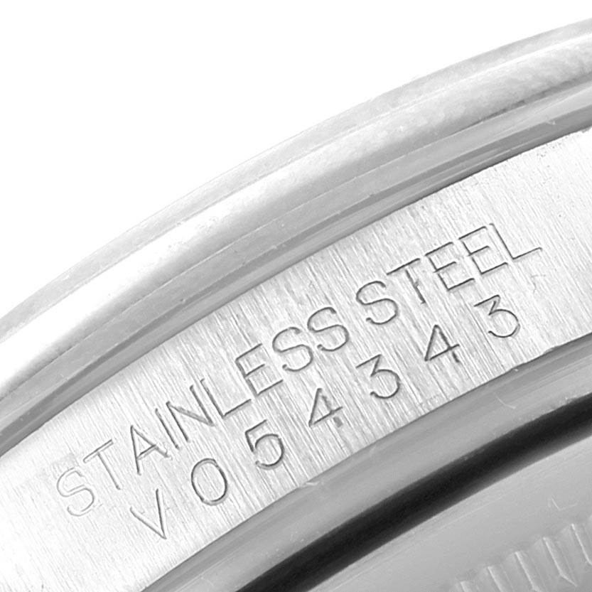 This image shows a close-up view of the case back of an Oyster Perpetual model by Rolex, displaying its serial number.