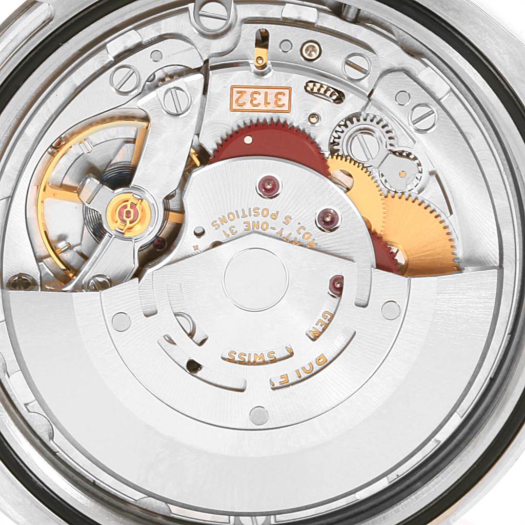 This image shows the intricate internal mechanism of the Rolex Oyster Perpetual 114300 Men
s Stainless Steel Blue Dial 114300 Men
s Stainless Steel Blue Dial watch from a close-up, top-down angle.