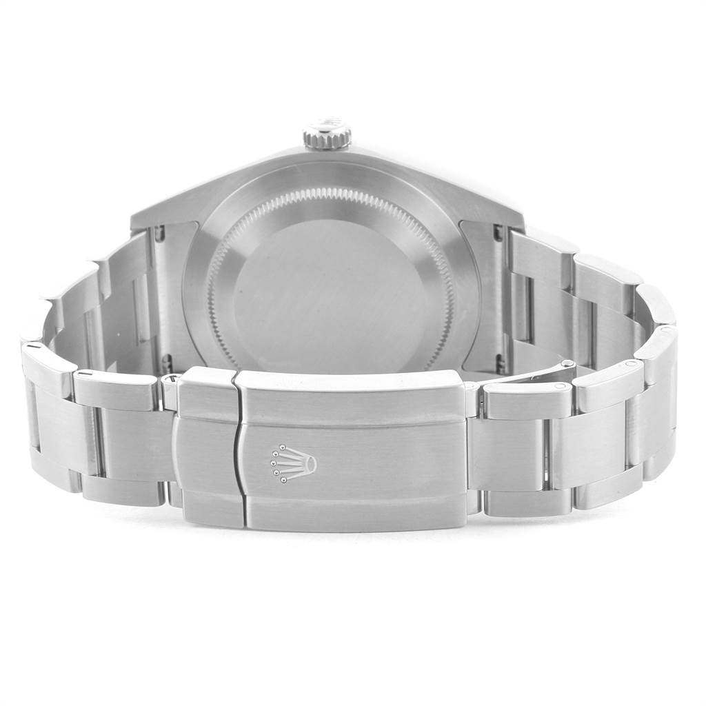 The image shows the stainless steel case back and clasp of the Rolex Oyster Perpetual 114300 Men
s Stainless Steel Blue Dial 114300 Men
s Stainless Steel Blue Dial watch from a rear angle.