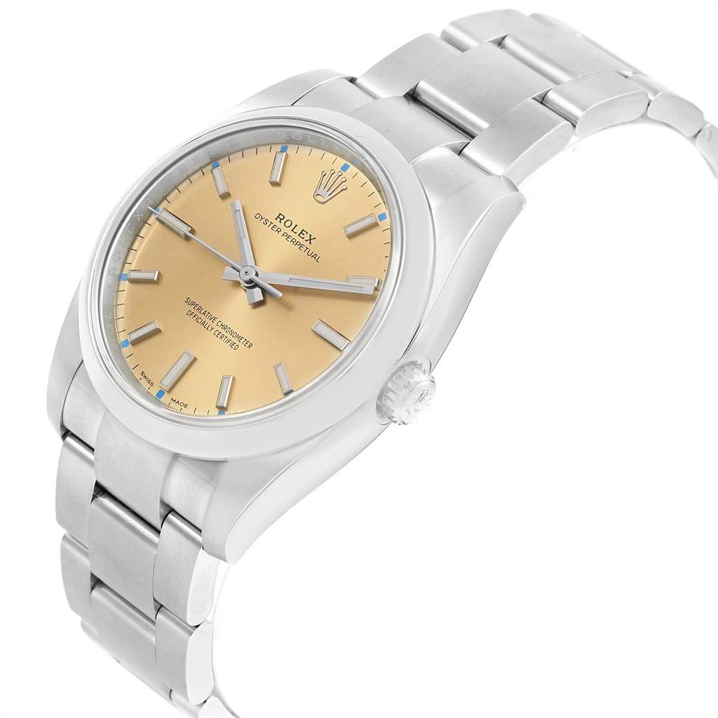 The image shows a Rolex Oyster Perpetual 114200 Men's Stainless Steel Champagne Dial 114200 Men's Stainless Steel Champagne Dial watch angled slightly to show its face, bezel, crown, and bracelet.