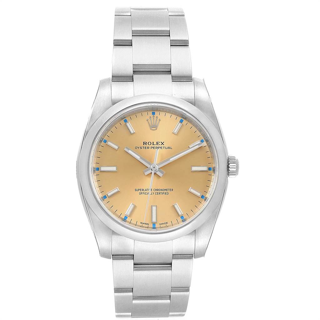The Rolex Oyster Perpetual 114200 Men's Stainless Steel Champagne Dial 114200 Men's Stainless Steel Champagne Dial watch is shown from a front angle, displaying the dial, hands, and bracelet.