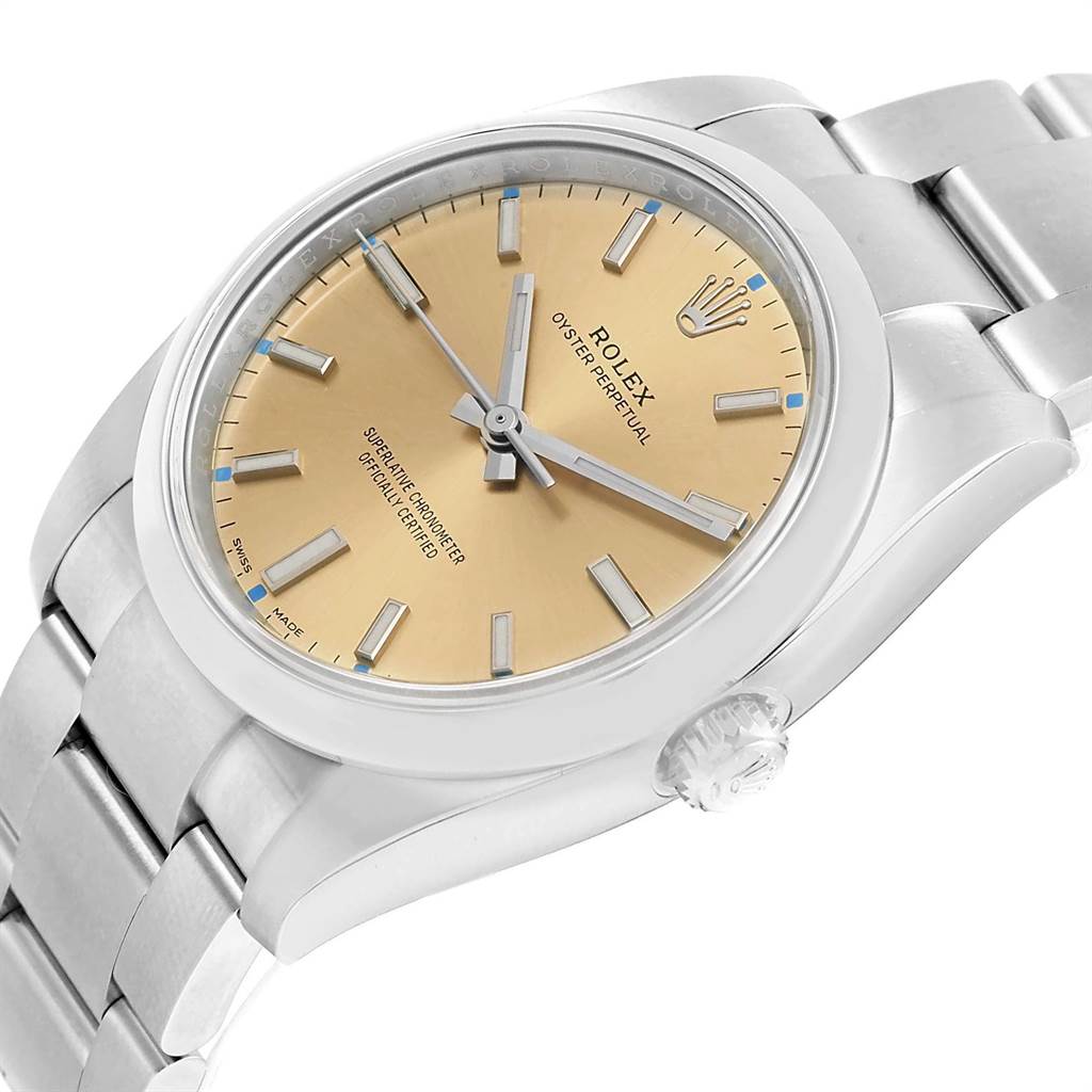 The image shows a Rolex Oyster Perpetual 114200 Men's Stainless Steel Champagne Dial 114200 Men's Stainless Steel Champagne Dial watch at a slight angle, highlighting the dial, crown, and bracelet.