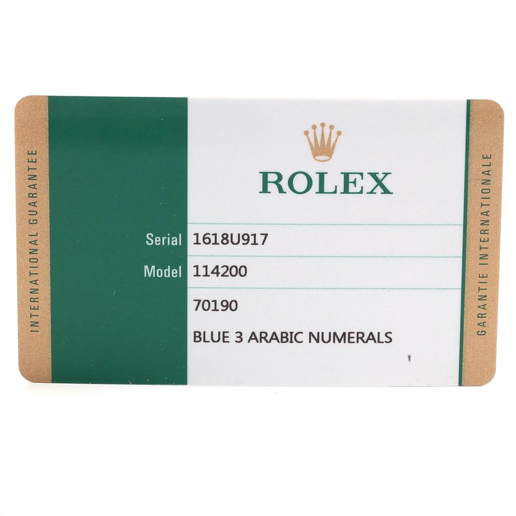 This image shows an international guarantee card for a Rolex Oyster Perpetual 114200 Men
s Stainless Steel Blue Dial 114200 Men
s Stainless Steel Blue Dial model with serial number 1618U917 and model number 114200.