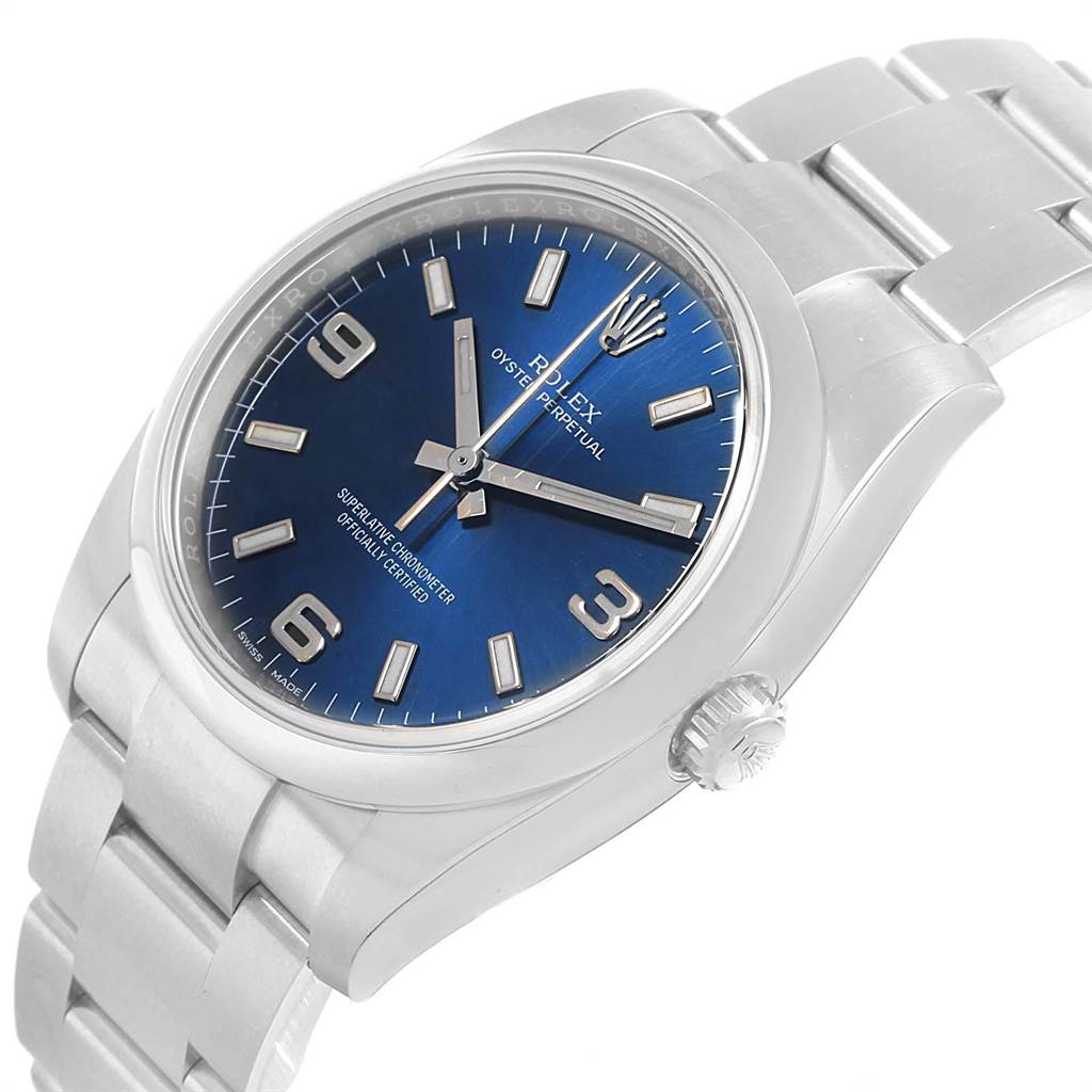 This image showcases a Rolex Oyster Perpetual 114200 Men
s Stainless Steel Blue Dial 114200 Men
s Stainless Steel Blue Dial watch at a slight angle, highlighting the blue dial, hour markers, hands, case, and stainless steel bracelet.