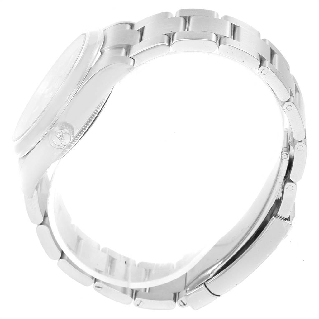 The image shows a side view of the Rolex Oyster Perpetual 114200 Men
s Stainless Steel Blue Dial 114200 Men
s Stainless Steel Blue Dial watch, focusing on the bracelet and case.