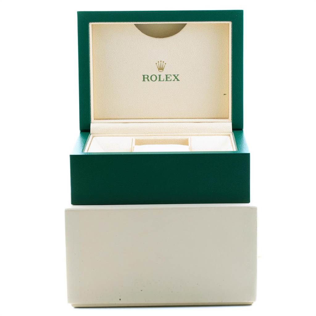 The image shows an open Rolex Oyster Perpetual 114300 Men
s Stainless Steel Grey Dial 114300 Men
s Stainless Steel Grey Dial watch box, displaying its interior compartments.