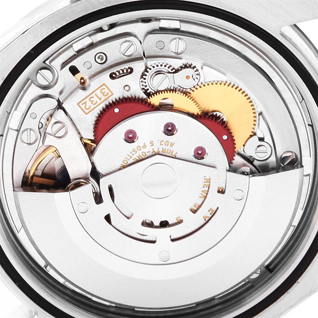 The image shows a close-up view of the movement mechanism inside a Rolex Oyster Perpetual 114300 Men
s Stainless Steel Grey Dial 114300 Men
s Stainless Steel Grey Dial watch.