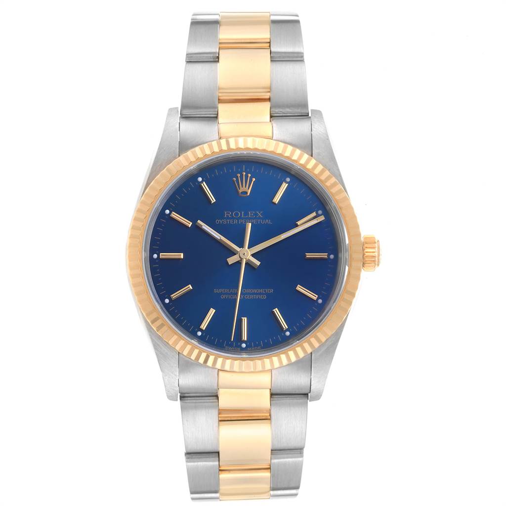 The Rolex Oyster Perpetual 14233 Men
s Steel and Gold (two tone) Blue Dial 14233 Men
s Steel and Gold (two tone) Blue Dial watch is shown from the front, featuring a two-tone bracelet and a blue dial.
