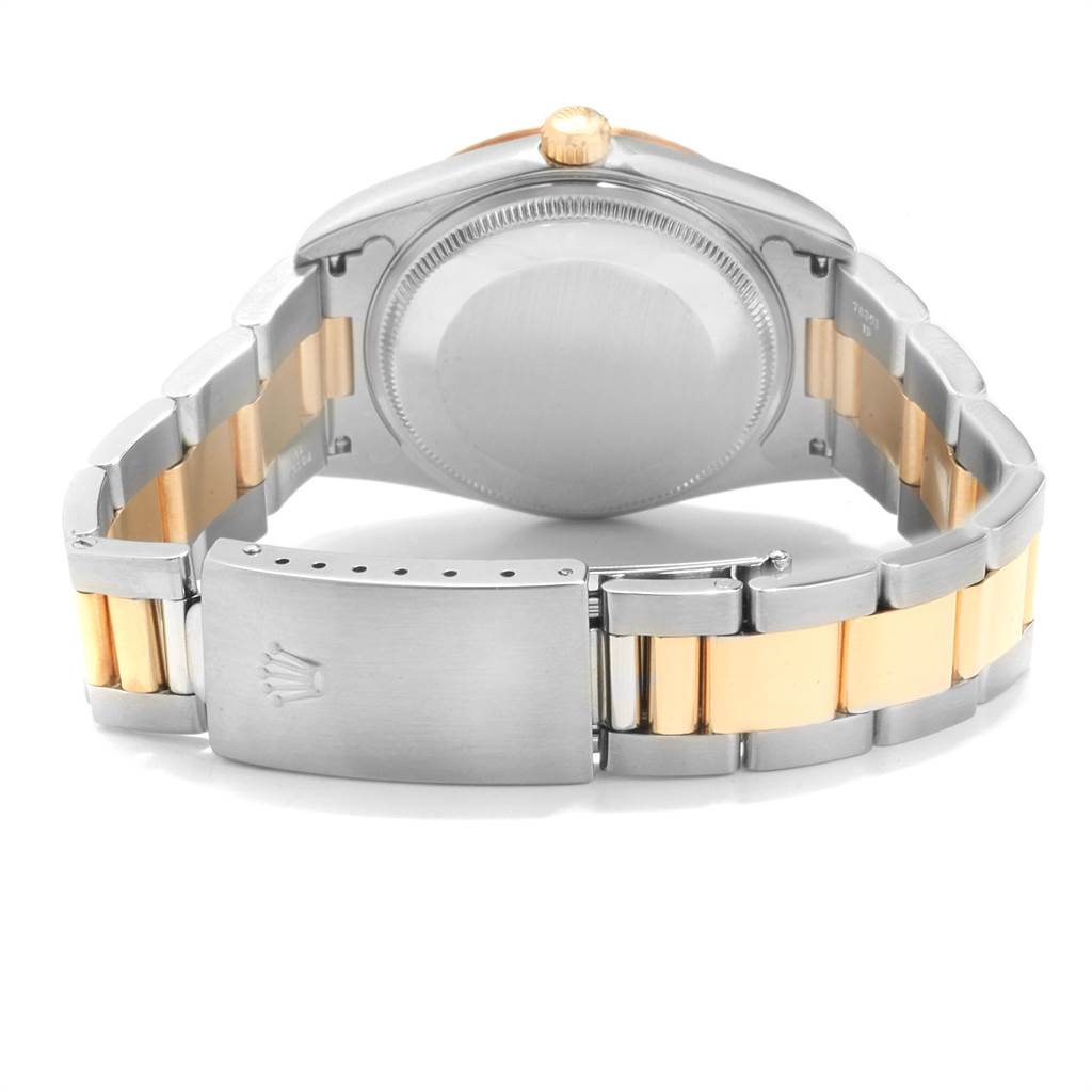 The image shows the back of a Rolex Oyster Perpetual 14233 Men
s Steel and Gold (two tone) Blue Dial 14233 Men
s Steel and Gold (two tone) Blue Dial watch, displaying the case back and two-tone bracelet with the clasp.