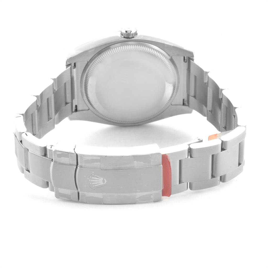 The image shows the back and bracelet clasp of a Rolex Oyster Perpetual 114200 Men
s Stainless Steel Champagne Dial 114200 Men
s Stainless Steel Champagne Dial watch from a rear angle.