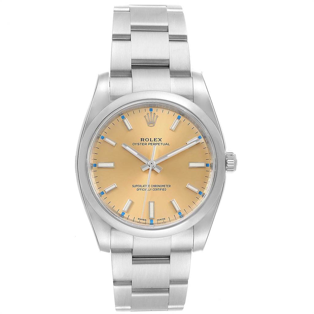 This Rolex Oyster Perpetual 114200 Men
s Stainless Steel Champagne Dial 114200 Men
s Stainless Steel Champagne Dial watch is shown from a front angle, displaying the dial, hands, crown, and bracelet.