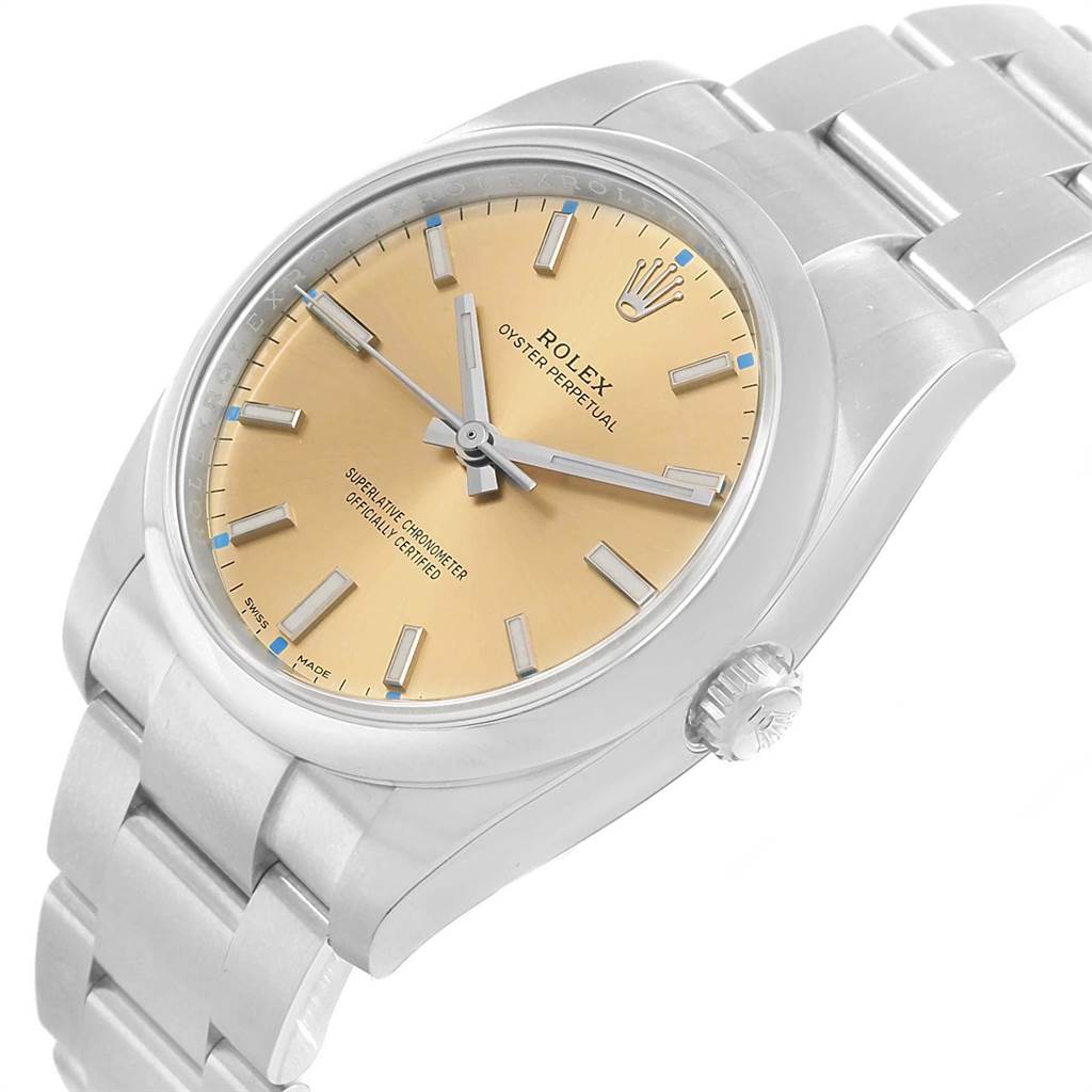 The Rolex Oyster Perpetual 114200 Men
s Stainless Steel Champagne Dial 114200 Men
s Stainless Steel Champagne Dial watch is shown at a slight angle, highlighting the face, bezel, crown, and bracelet.