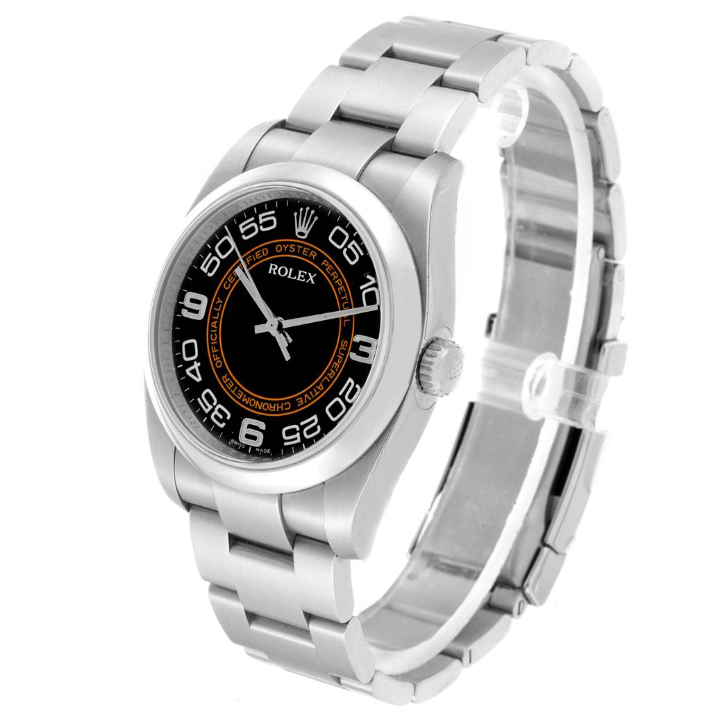 The Rolex Oyster Perpetual 116000 Men
s Stainless Steel Black Dial 116000 Men
s Stainless Steel Black Dial watch is shown at a three-quarter angle, highlighting the face, bezel, and part of the bracelet.