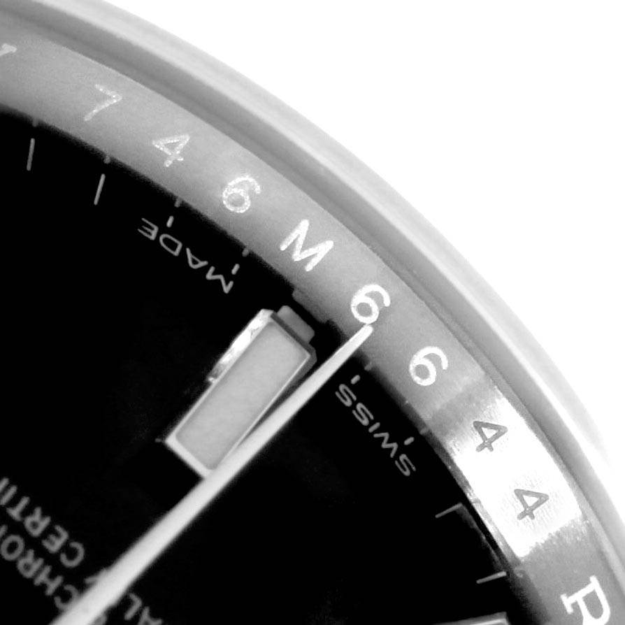 The image shows a close-up view of the dial and hands of a Rolex Oyster Perpetual 114200 Men
s Stainless Steel Black Dial 114200 Men
s Stainless Steel Black Dial watch.