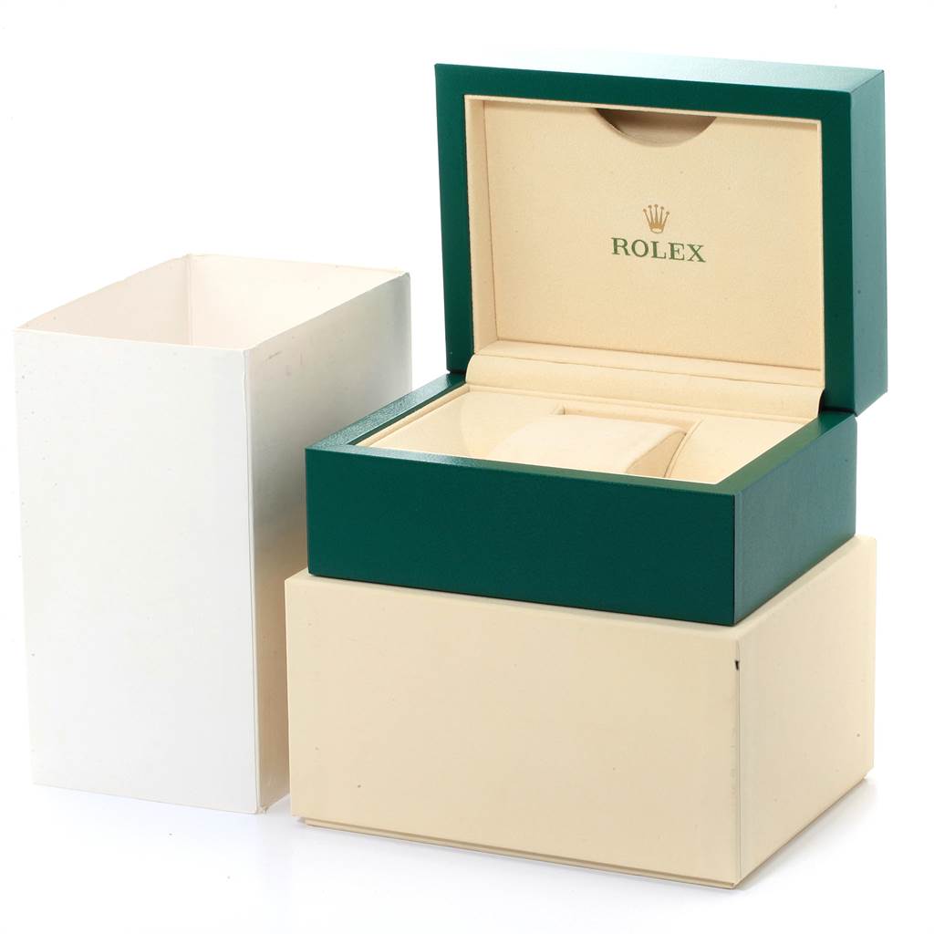 The image shows an open green and beige Rolex Oyster Perpetual 116034 Men's Stainless Steel Blue Dial 116034 Men's Stainless Steel Blue Dial watch box and its outer packaging.