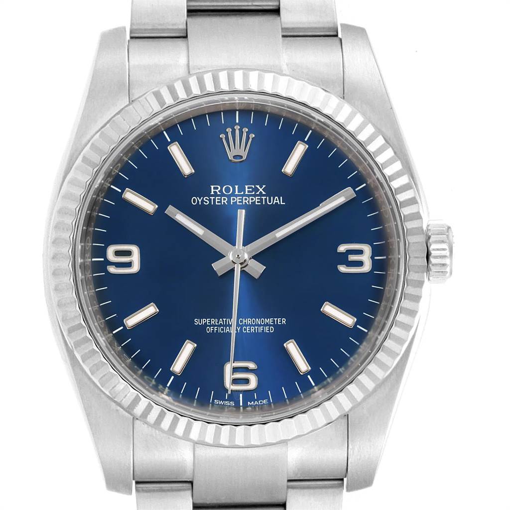 The image shows a front view of a Rolex Oyster Perpetual 116034 Men's Stainless Steel Blue Dial 116034 Men's Stainless Steel Blue Dial watch with a blue dial and silver bracelet.