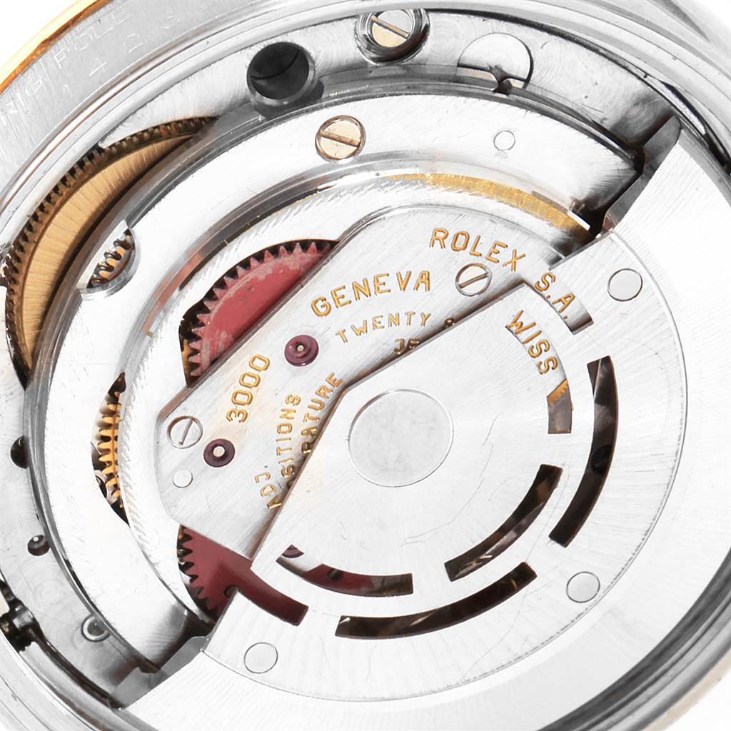 This image shows the internal movement mechanism of the Rolex Oyster Perpetual 14233 Men's Steel and Gold (two tone) Blue Dial 14233 Men's Steel and Gold (two tone) Blue Dial watch, showcasing gears and components.