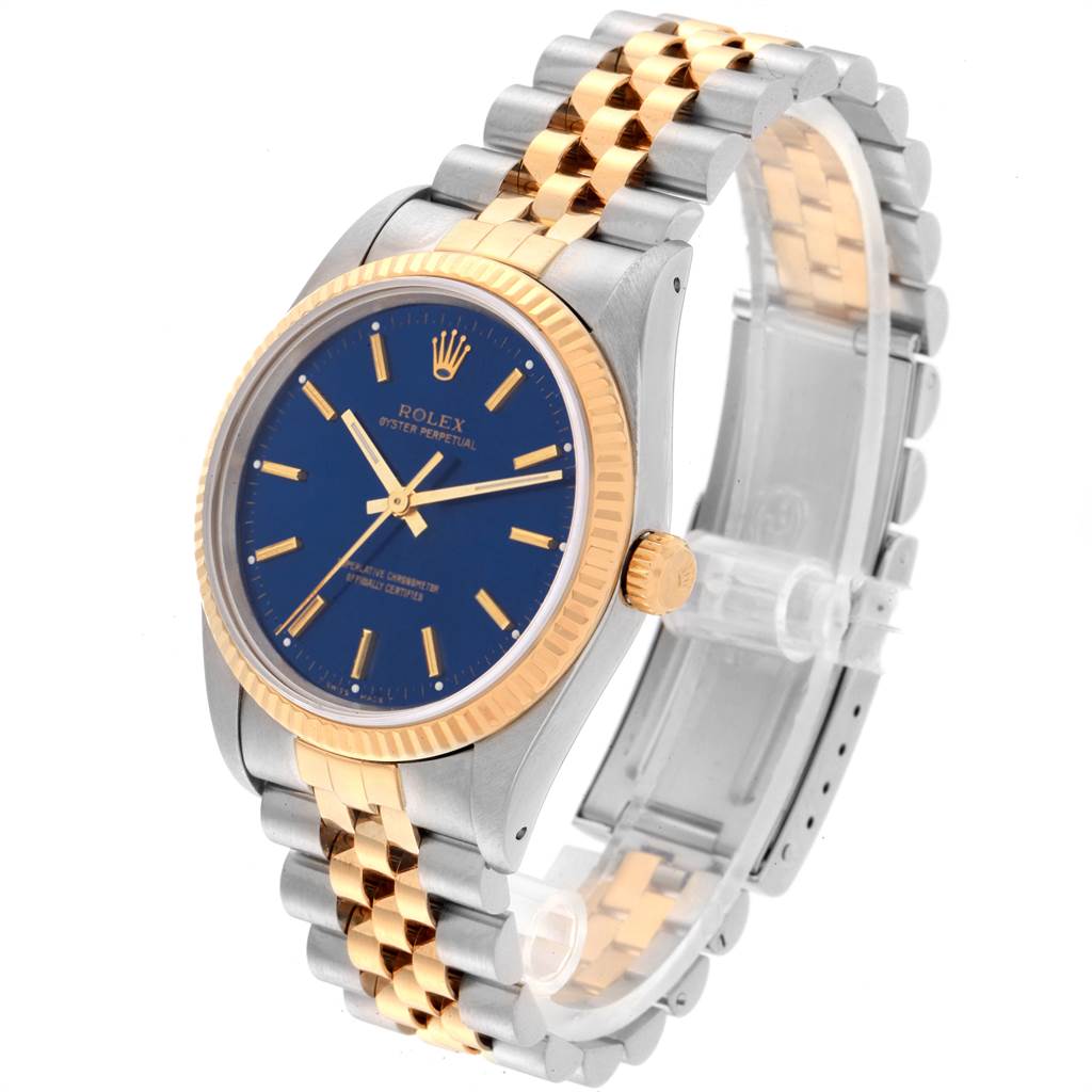 The Rolex Oyster Perpetual 14233 Men's Steel and Gold (two tone) Blue Dial 14233 Men's Steel and Gold (two tone) Blue Dial watch is shown at a slight angle, highlighting its blue dial, two-tone bracelet, and gold bezel.