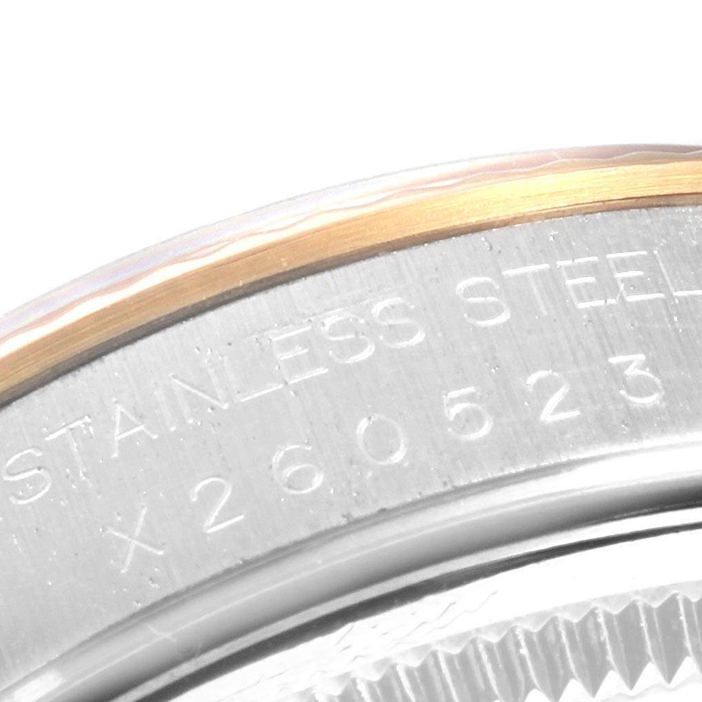 This image shows a close-up of the case back engraving on a Rolex Oyster Perpetual 14233 Men's Steel and Gold (two tone) Blue Dial 14233 Men's Steel and Gold (two tone) Blue Dial watch.