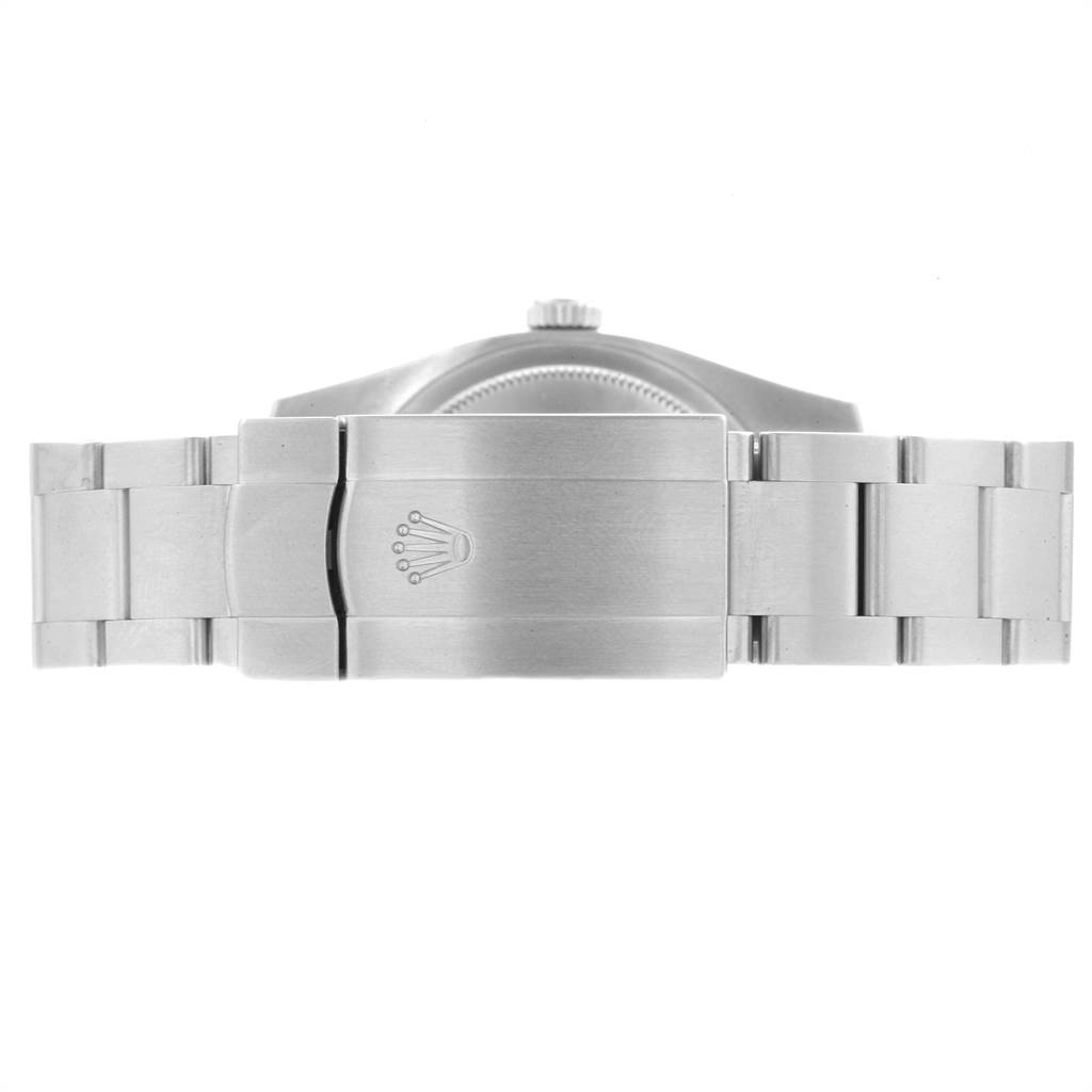 The image shows the clasp and part of the bracelet of a Rolex Oyster Perpetual 116000 Men's Stainless Steel Silver Dial 116000 Men's Stainless Steel Silver Dial watch from the back.