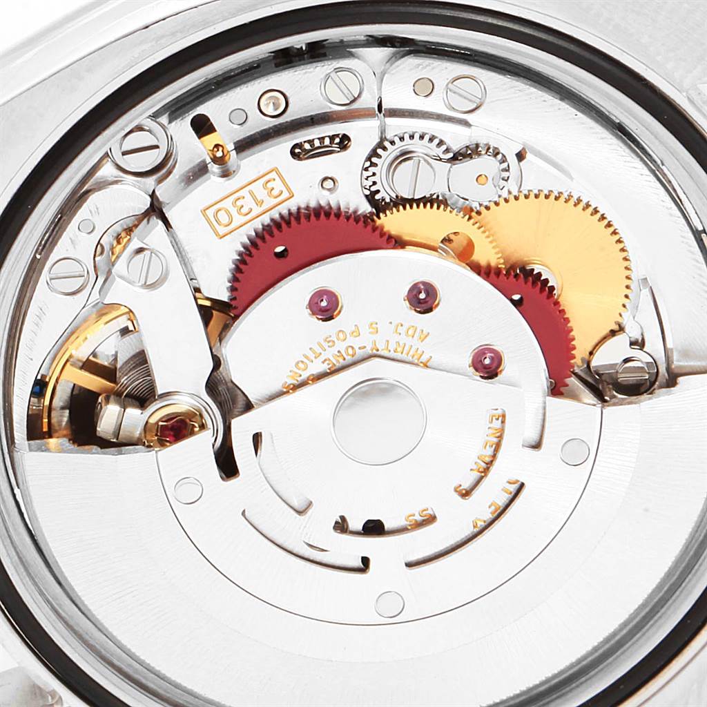 This image shows a detailed close-up view of the internal movement mechanism of a Rolex Oyster Perpetual 116000 Men's Stainless Steel Silver Dial 116000 Men's Stainless Steel Silver Dial watch.