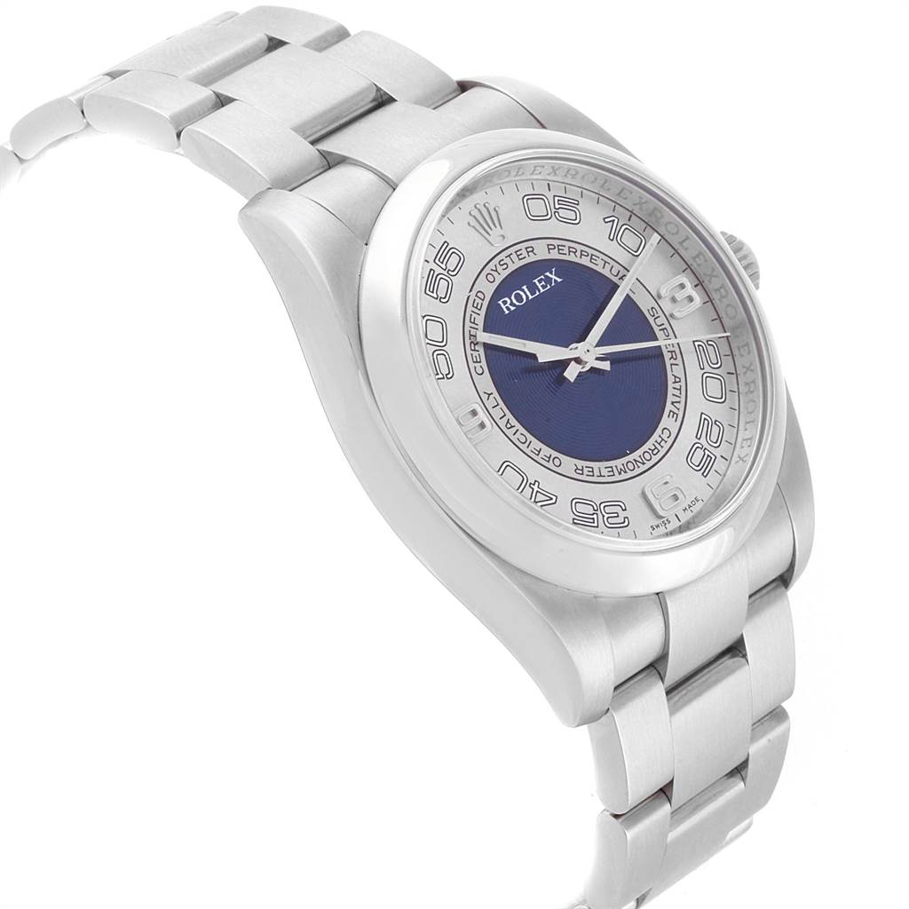 The Rolex Oyster Perpetual 116000 Men's Stainless Steel Silver Dial 116000 Men's Stainless Steel Silver Dial watch is shown at a slight angle, highlighting its face, bezel, and part of the bracelet.