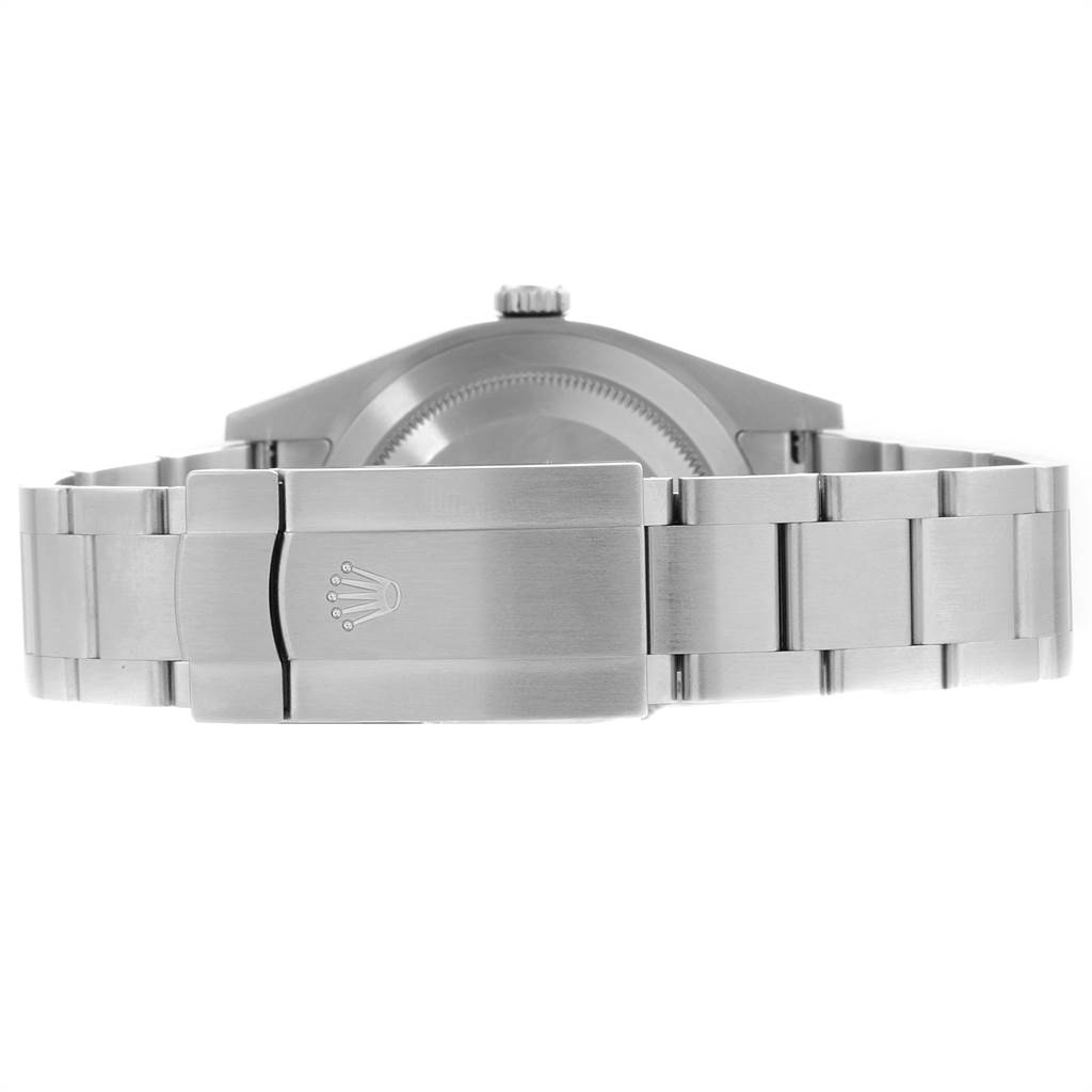 The image shows the clasp and bracelet of a Rolex Oyster Perpetual 114300 Men's Stainless Steel Blue Dial 114300 Men's Stainless Steel Blue Dial watch from a rear angle.