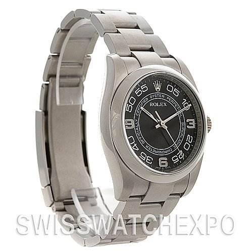 The image shows a side angle of a Rolex Oyster Perpetual 116000 Men's Stainless Steel Black Dial 116000 Men's Stainless Steel Black Dial watch with a stainless steel bracelet and a black dial.