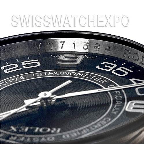 This close-up shows the dial and partial bezel of a Rolex Oyster Perpetual 116000 Men's Stainless Steel Black Dial 116000 Men's Stainless Steel Black Dial, highlighting the serial number.