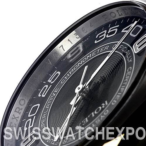 This image shows a close-up, angled view of the dial on a Rolex Oyster Perpetual 116000 Men's Stainless Steel Black Dial 116000 Men's Stainless Steel Black Dial watch.