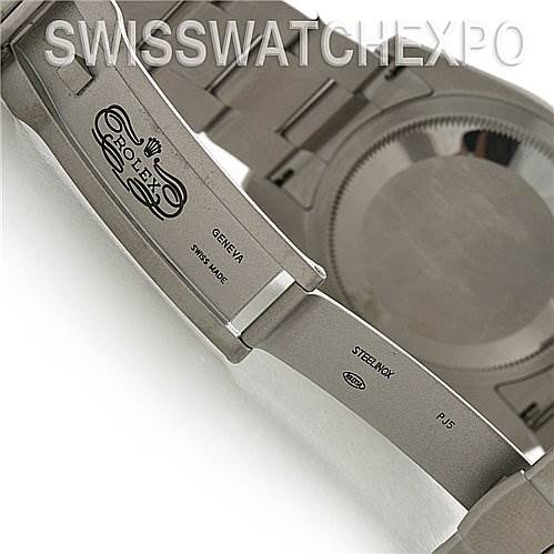 The image shows the open clasp and underside of the bracelet of a Rolex Oyster Perpetual 116000 Men's Stainless Steel Black Dial 116000 Men's Stainless Steel Black Dial watch, showcasing the logo and inscription.