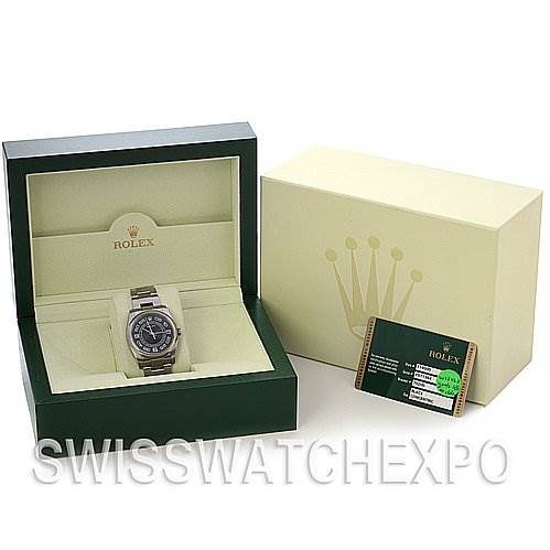 The Rolex Oyster Perpetual 116000 Men's Stainless Steel Black Dial 116000 Men's Stainless Steel Black Dial watch is shown inside its box, alongside an outer box and a certification card.