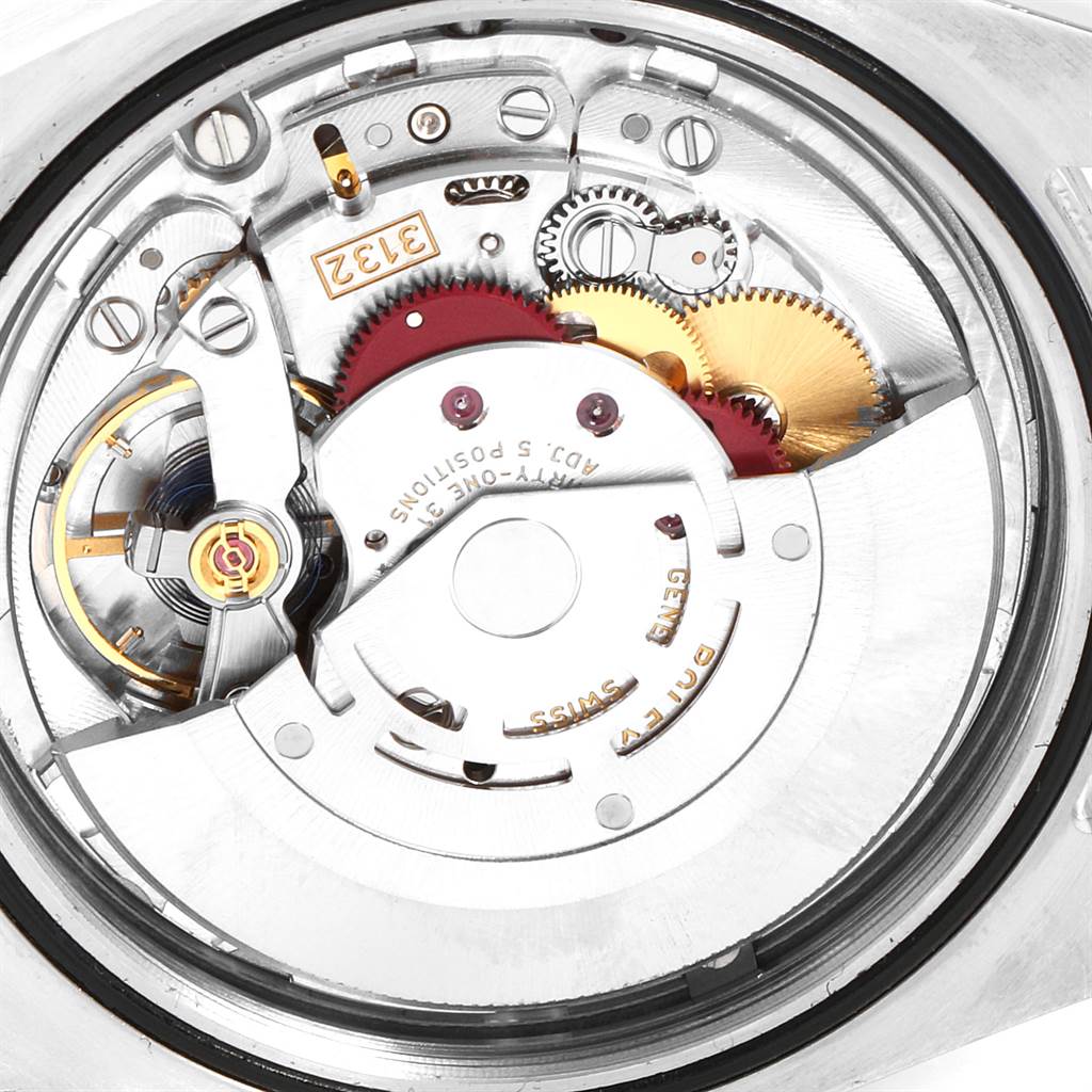 This image shows a close-up view of the movement mechanism inside a Rolex Oyster Perpetual 114300 Men
s Stainless Steel Blue Dial 114300 Men
s Stainless Steel Blue Dial watch.