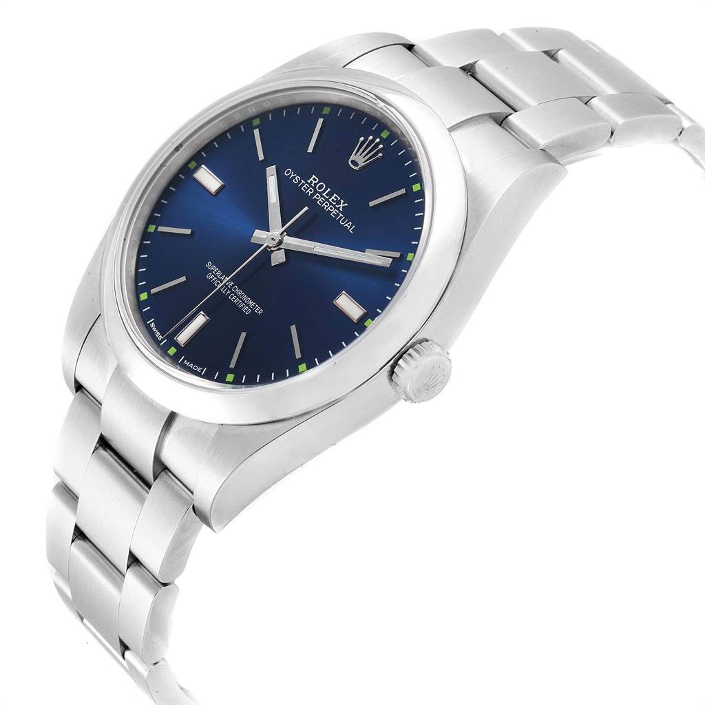 The Rolex Oyster Perpetual 114300 Men
s Stainless Steel Blue Dial 114300 Men
s Stainless Steel Blue Dial watch is shown at an angled view, highlighting the blue dial, crown, and metal bracelet.