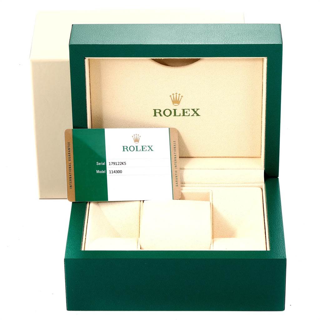 This is a straight-on view of the Rolex Oyster Perpetual 114300 Men
s Stainless Steel Blue Dial 114300 Men
s Stainless Steel Blue Dial watch box, including a warranty card.