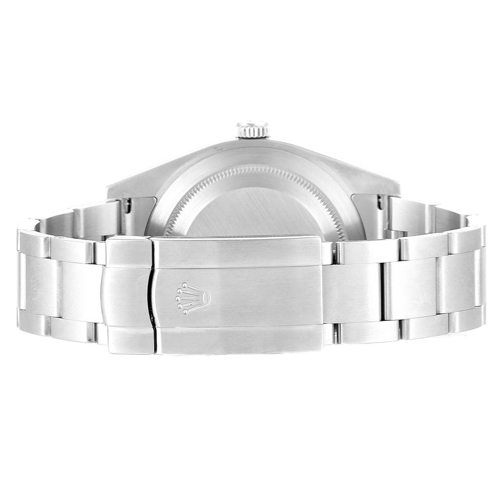 The image shows the back case and clasp of a Rolex Oyster Perpetual 114300 Men
s Stainless Steel Blue Dial 114300 Men
s Stainless Steel Blue Dial watch.