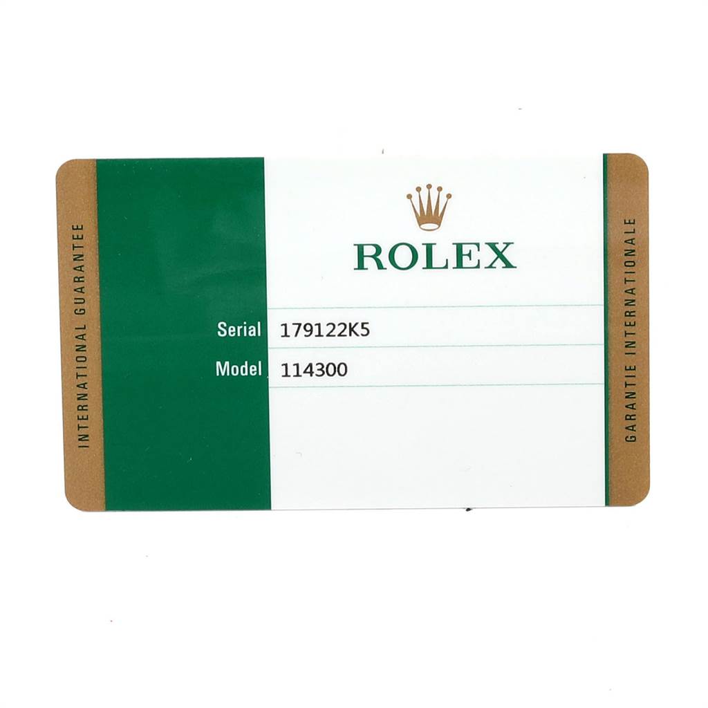 The image shows the international guarantee card for the Rolex Oyster Perpetual 114300 Men
s Stainless Steel Blue Dial 114300 Men
s Stainless Steel Blue Dial model 114300, including serial number 179122K5.