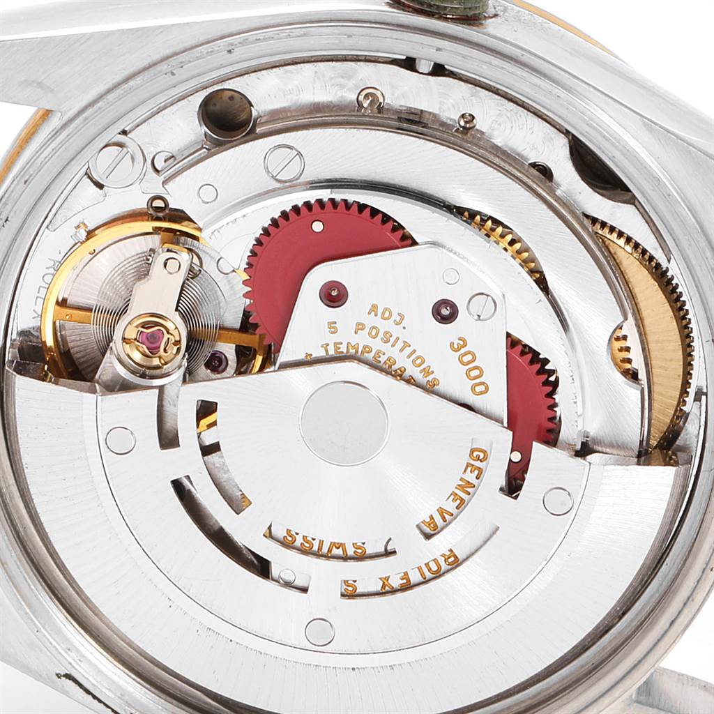 This image shows the inner mechanical movements of a Rolex Oyster Perpetual 14203 Men's Steel and Gold (two tone) Grey Dial 14203 Men's Steel and Gold (two tone) Grey Dial watch from a close-up angle.