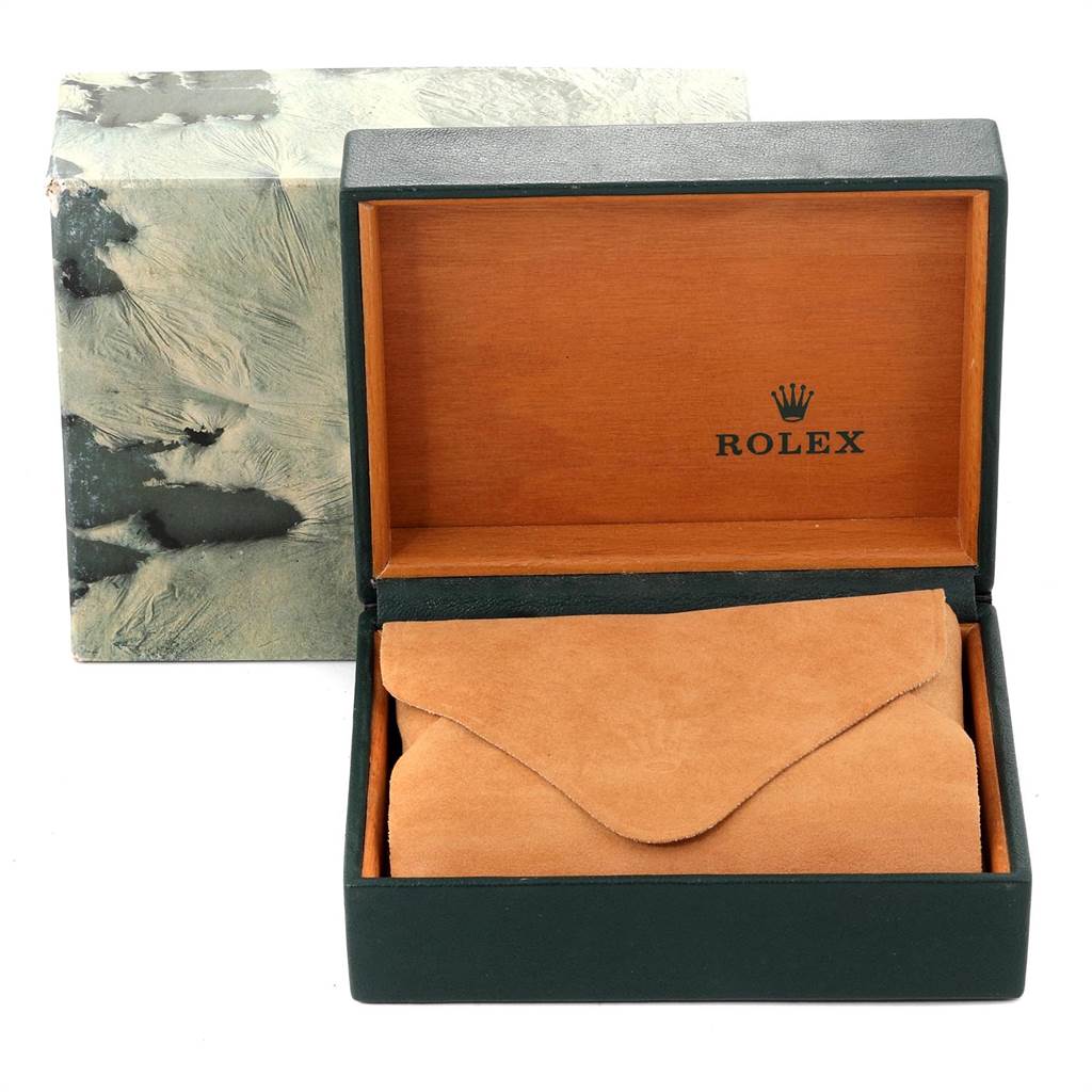 This image shows an open Rolex box for an Oyster Perpetual model, displaying the branded interior and a protective pouch.