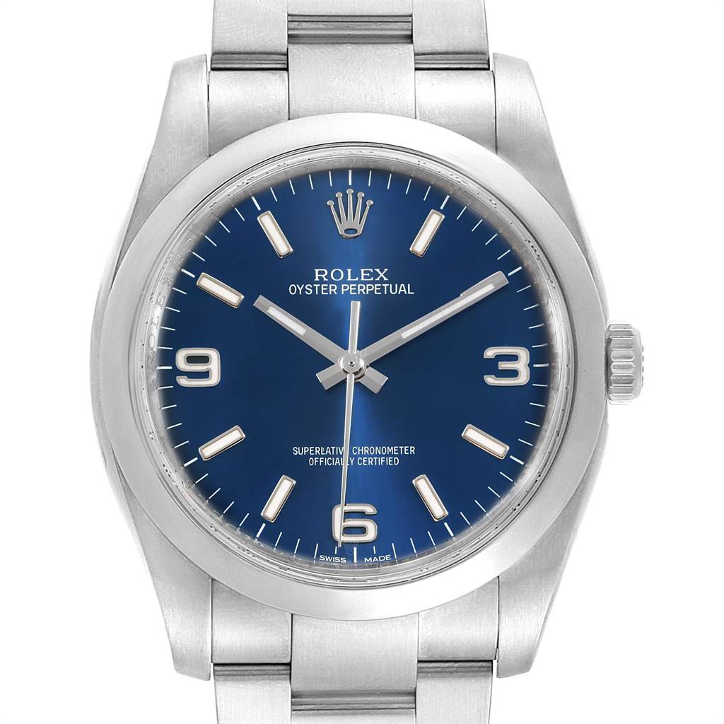 The Rolex Oyster Perpetual 116000 Men's Stainless Steel Blue Dial 116000 Men's Stainless Steel Blue Dial watch is shown from the front, highlighting its blue dial, case, bezel, crown, and part of the bracelet.