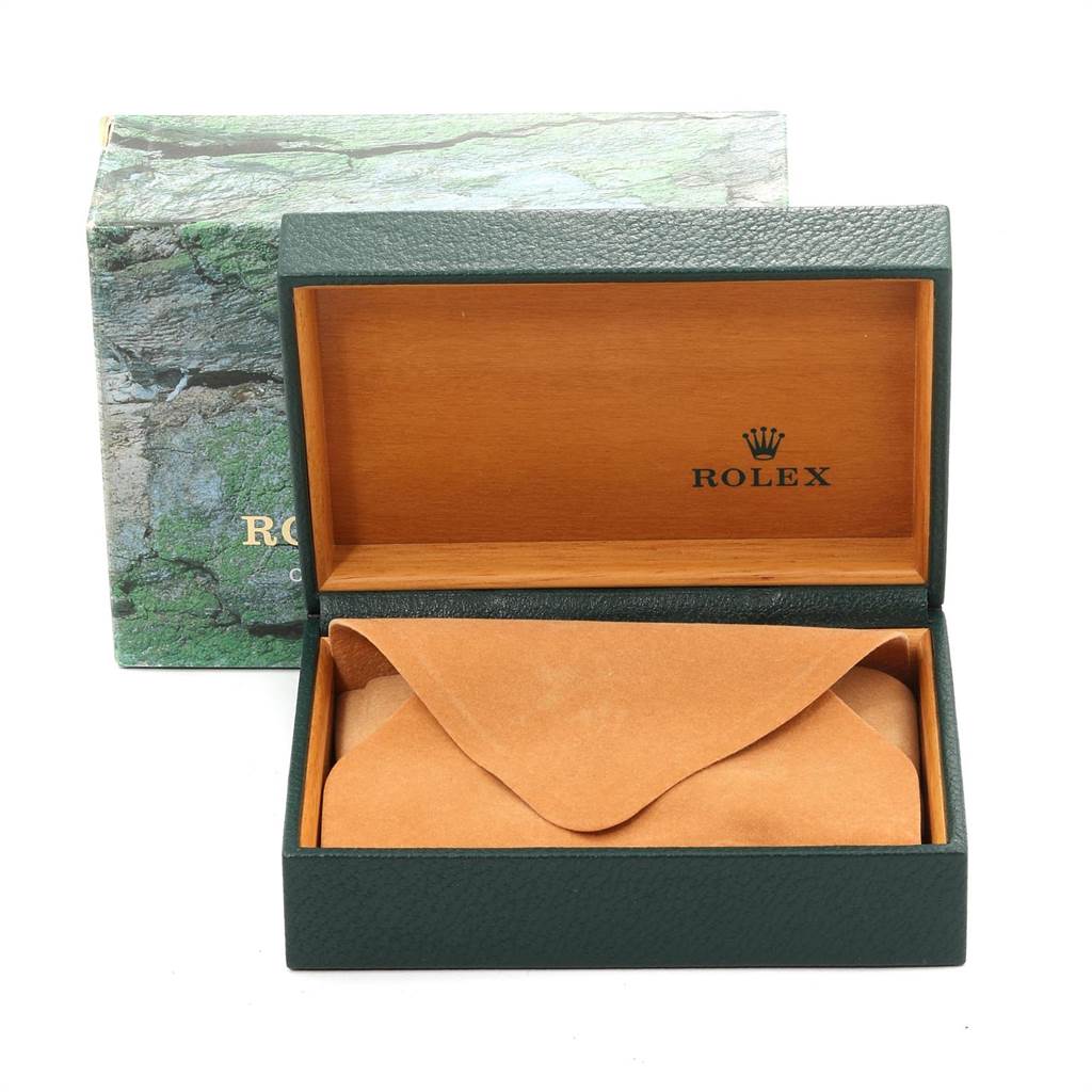 The image shows an open Rolex Oyster Perpetual 14203 Men's Steel and Gold (two tone) Grey Dial 14203 Men's Steel and Gold (two tone) Grey Dial watch box with a green exterior, brown interior, and the Rolex logo inside.