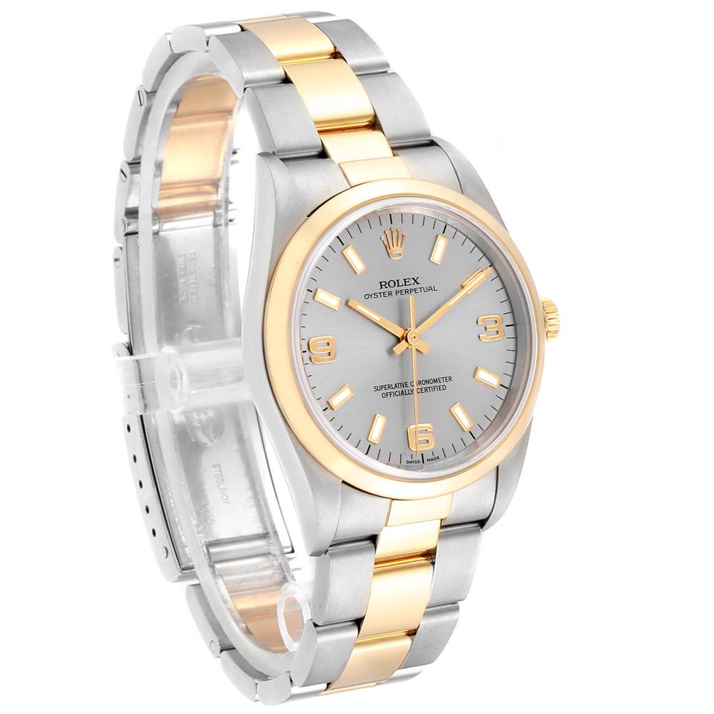 The image shows a side view of a Rolex Oyster Perpetual 14203 Men's Steel and Gold (two tone) Grey Dial 14203 Men's Steel and Gold (two tone) Grey Dial watch, highlighting its silver dial, gold-accented hour markers, and two-tone bracelet.