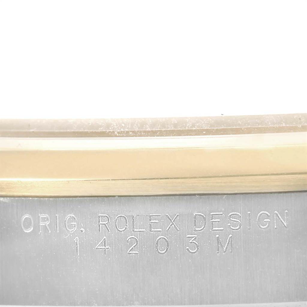 This is a close-up angle of the case side, showing the engraved model number and "ORIG. ROLEX DESIGN" on a Rolex Oyster Perpetual 14203 Men's Steel and Gold (two tone) Grey Dial 14203 Men's Steel and Gold (two tone) Grey Dial.