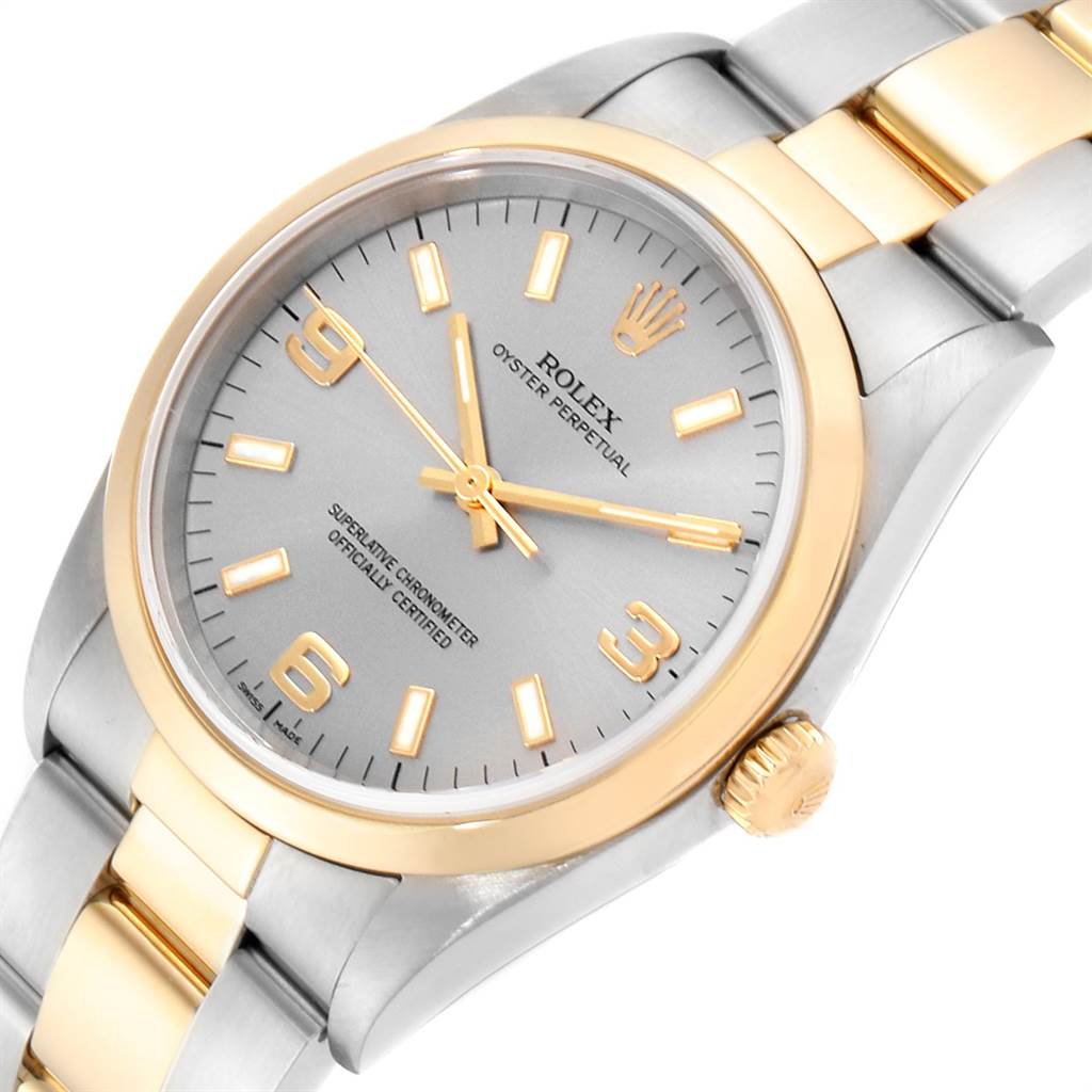 The image shows a close-up, angled view of a Rolex Oyster Perpetual 14203 Men's Steel and Gold (two tone) Grey Dial 14203 Men's Steel and Gold (two tone) Grey Dial watch showcasing its dial, crown, and part of the bracelet.