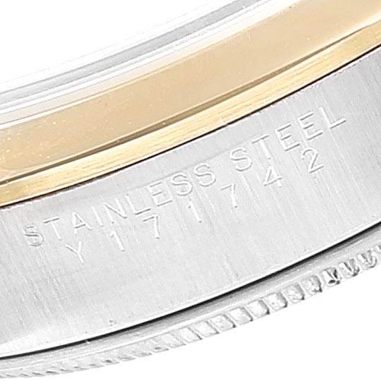 The image shows a close-up of the side of the bezel and case of a Rolex Oyster Perpetual 14203 Men's Steel and Gold (two tone) Grey Dial 14203 Men's Steel and Gold (two tone) Grey Dial, highlighting engraved text.