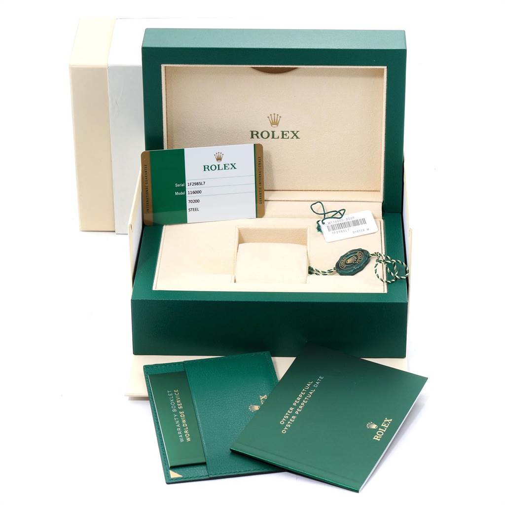 The image shows an open Rolex Oyster Perpetual 116000 Men's Stainless Steel Grey Dial 116000 Men's Stainless Steel Grey Dial watch box with a warranty card, manuals, and accessories.