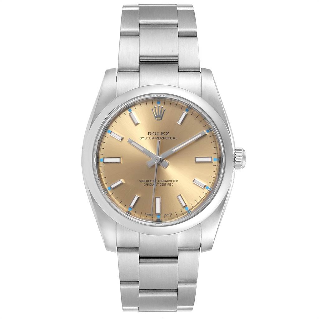 The image shows a front view of the Rolex Oyster Perpetual 114200 Men's Stainless Steel Champagne Dial 114200 Men's Stainless Steel Champagne Dial watch, highlighting the dial, bezel, and bracelet.