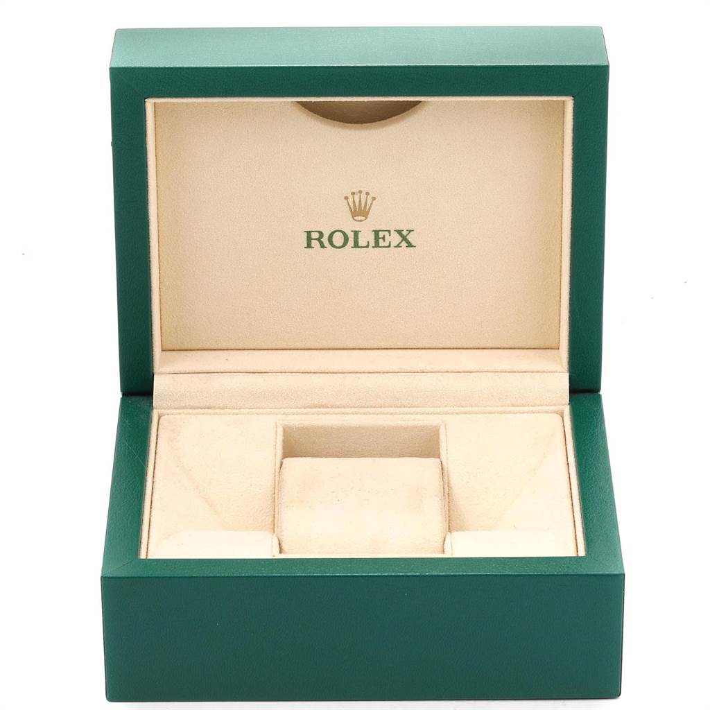 The image shows an open Rolex Oyster Perpetual 116000 Men's Stainless Steel Silver Dial 116000 Men's Stainless Steel Silver Dial watch box with green exterior and beige interior.