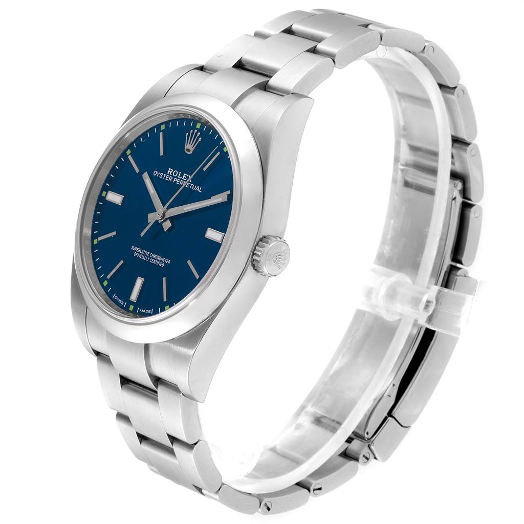 This image shows a side angle view of the Rolex Oyster Perpetual 114300 Men's Stainless Steel Blue Dial 114300 Men's Stainless Steel Blue Dial watch, highlighting the blue dial, crown, and stainless steel bracelet.